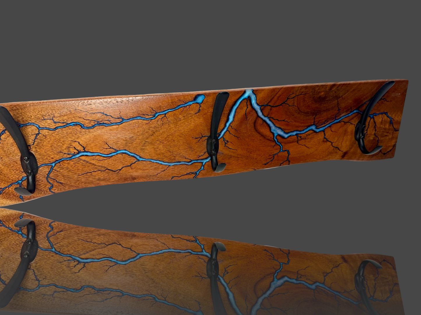 Rustic timber coat rack with bold electric burn lines