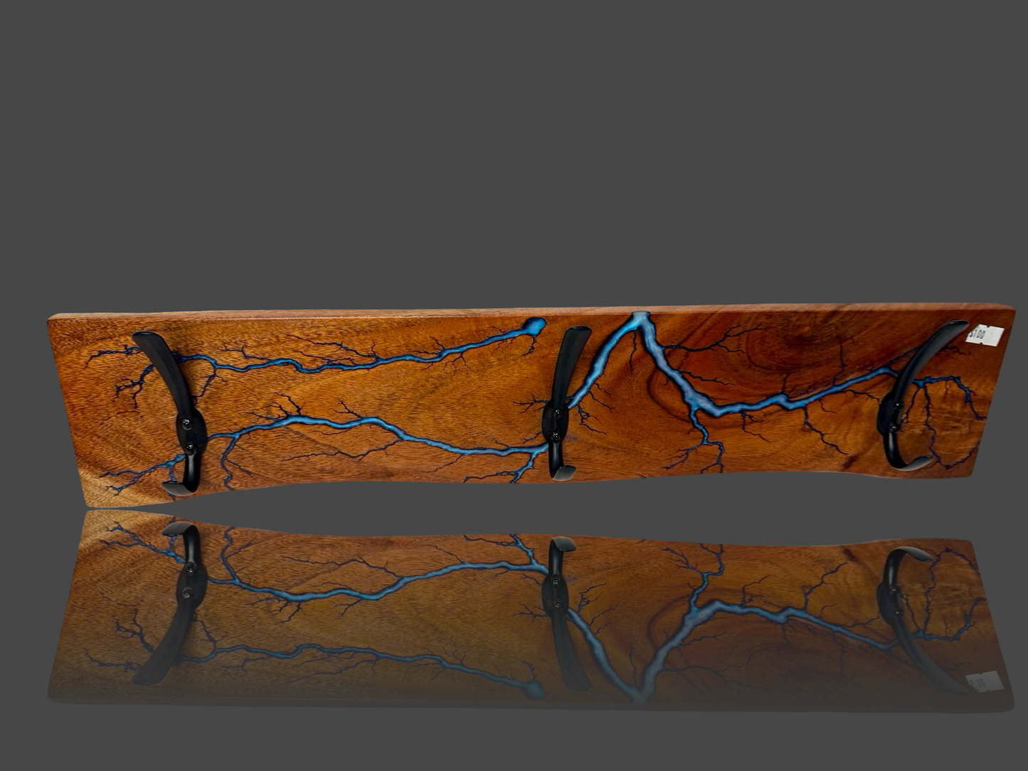 One-of-a-kind wall rack with high-voltage fractal burn design