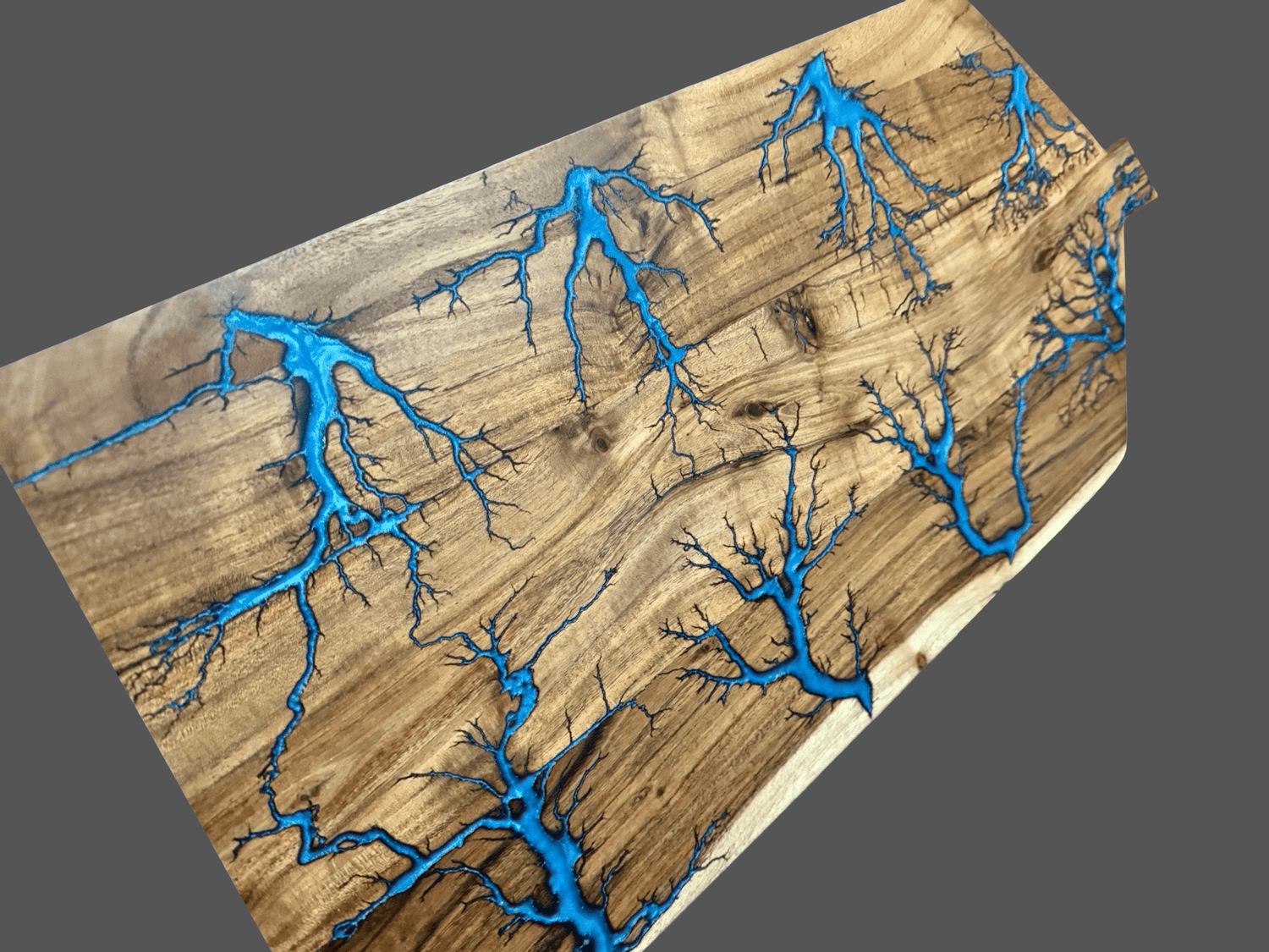 Grazing platter boards by Fractal Flow Designs – handcrafted from Australian hardwood with bold resin inlays and fractal burning. Premium serving boards for charcuterie, cheese, and entertaining. Artisan timber platters made in Bairnsdale Victoria.