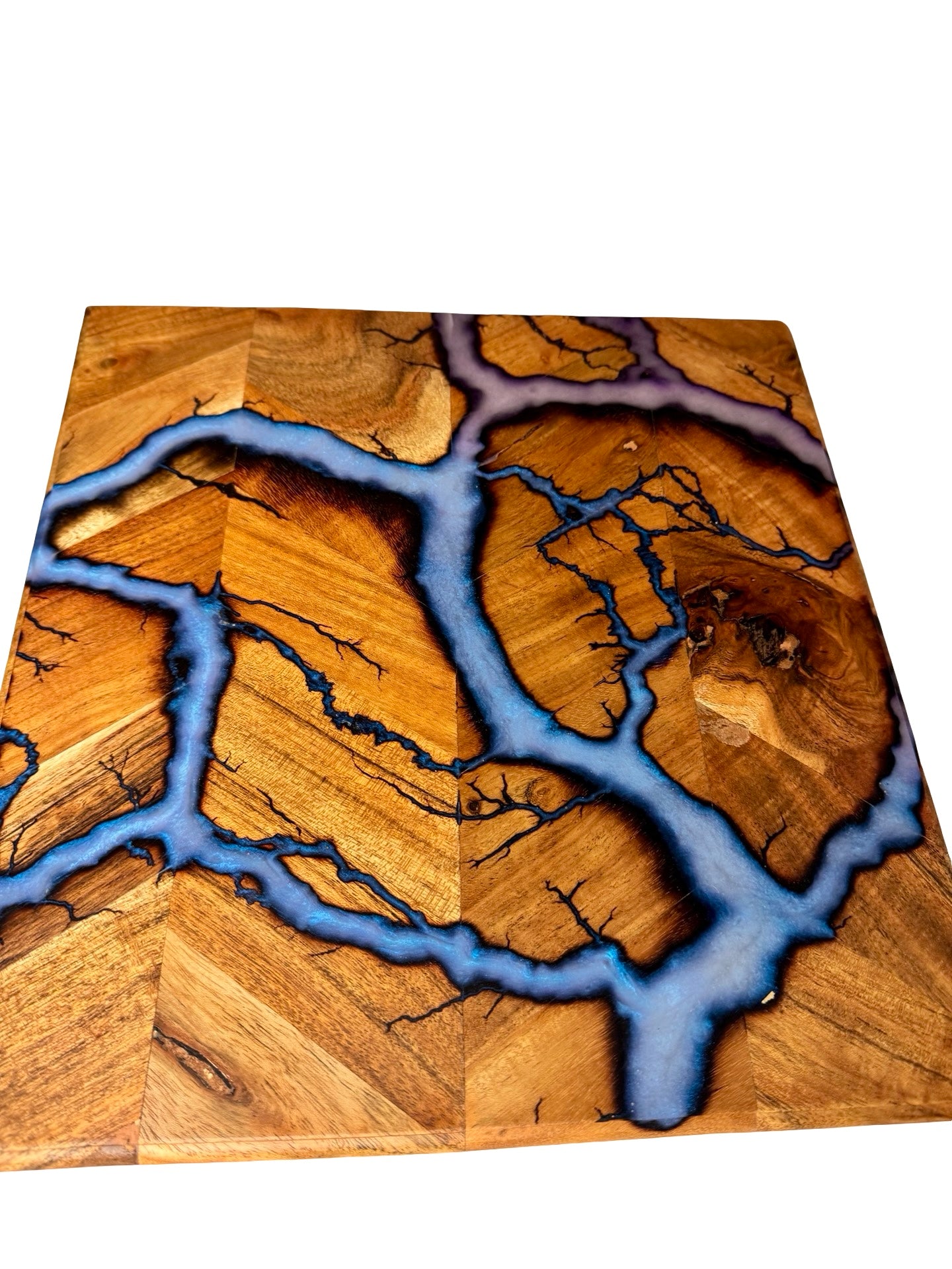 iridescent blue resin art on a acacia timber square chopping board made in australia by fractal flow designs