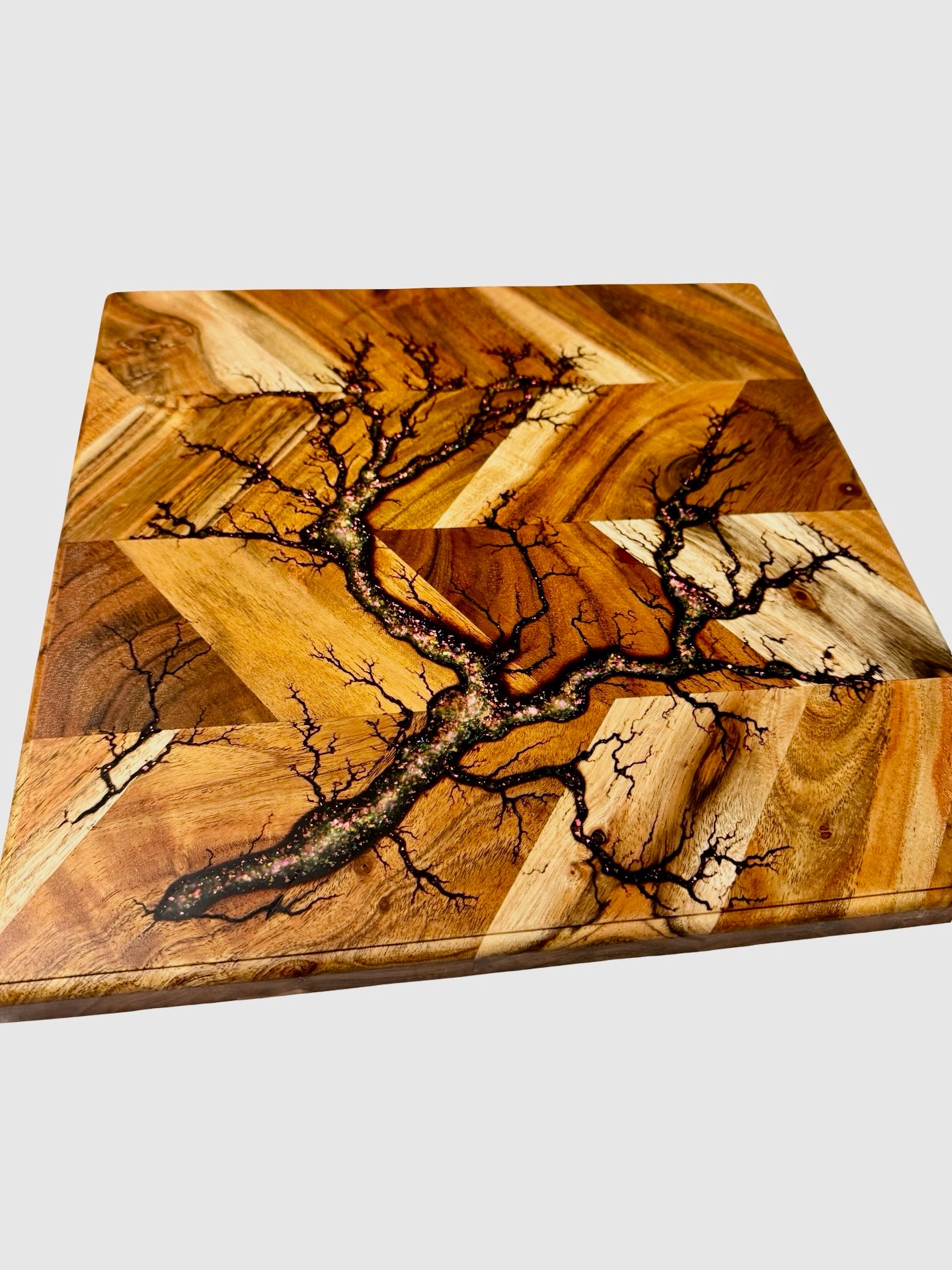 sqare chopping board with herringbone pattern timer and fractal burning art inlayed with sparkle resin made by fracal flow designs in australia