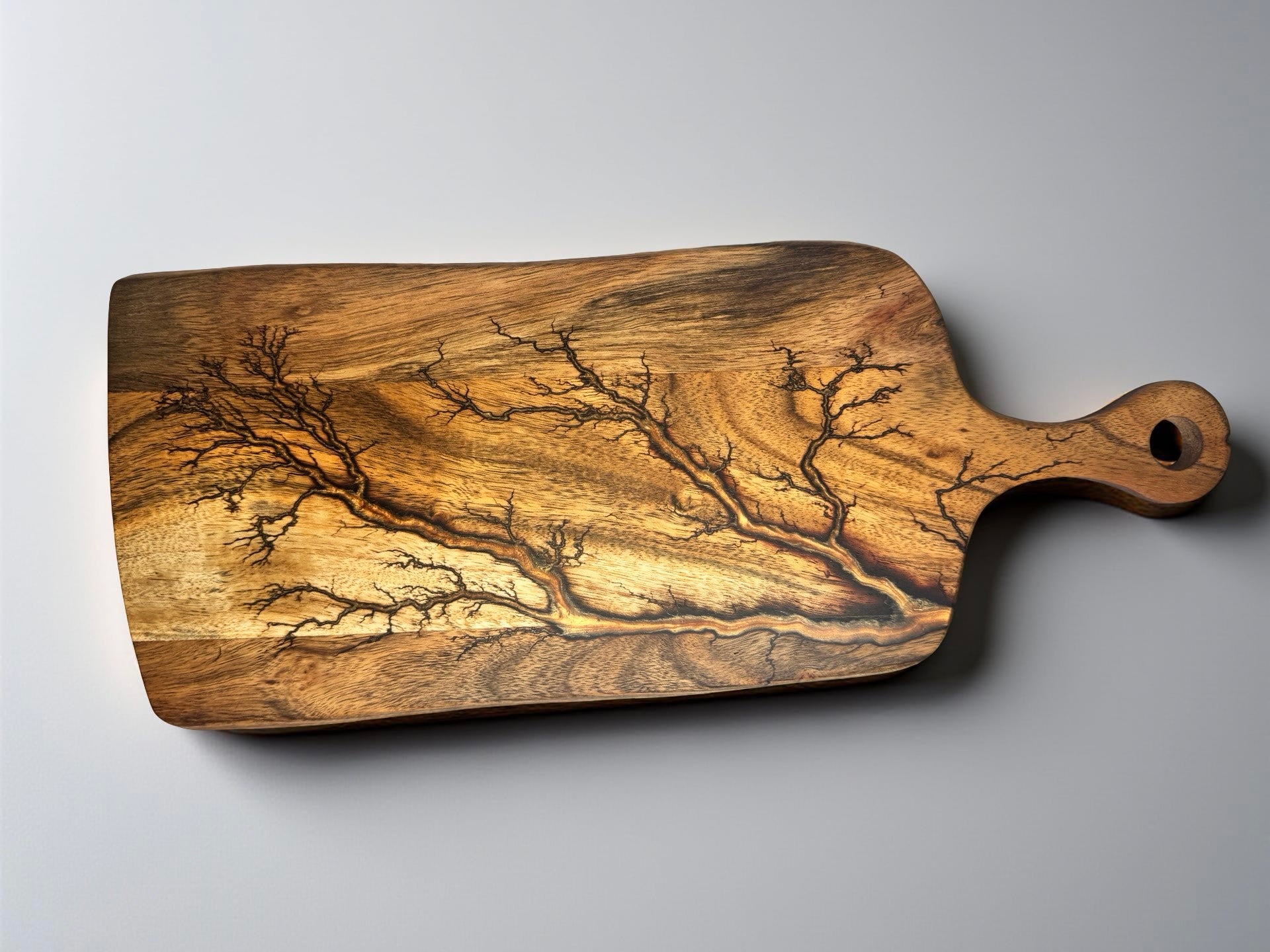 Premium acacia paddle cheese board with shimmering copper resin and natural fractal burning design, Australian handmade serving board, Fractal Flow Designs