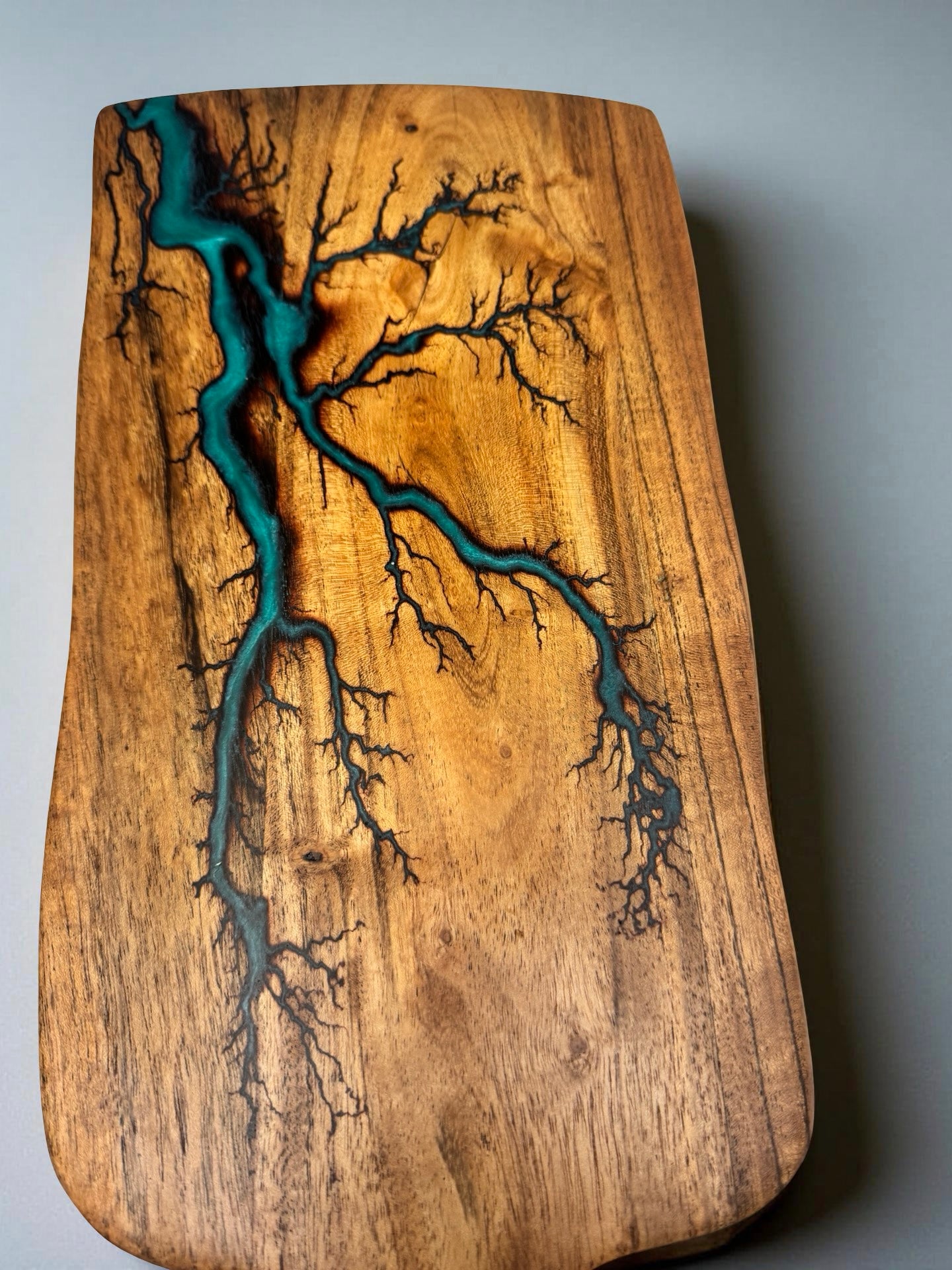 Handcrafted acacia paddle cheese board featuring deep green resin art and fractal burning lightning pattern, Australian resin boards East Gippsland, Fractal Flow Designs