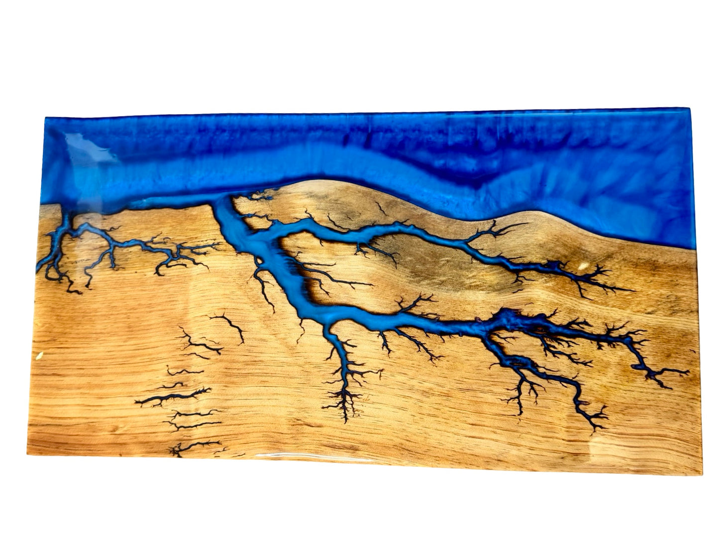 premium resin board made by fractal flow designs in austraia featuring art created by electricity in blue sapphire resin , large in size 600mm 