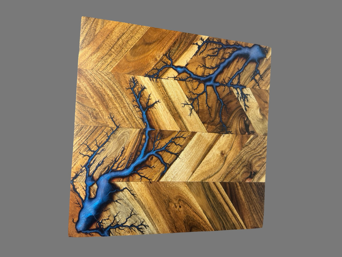 Electrifying fractal burn pattern chopping board with resin inlay by Fractal Flow Designs. Unique handmade Australian timber piece — no two boards are ever the same