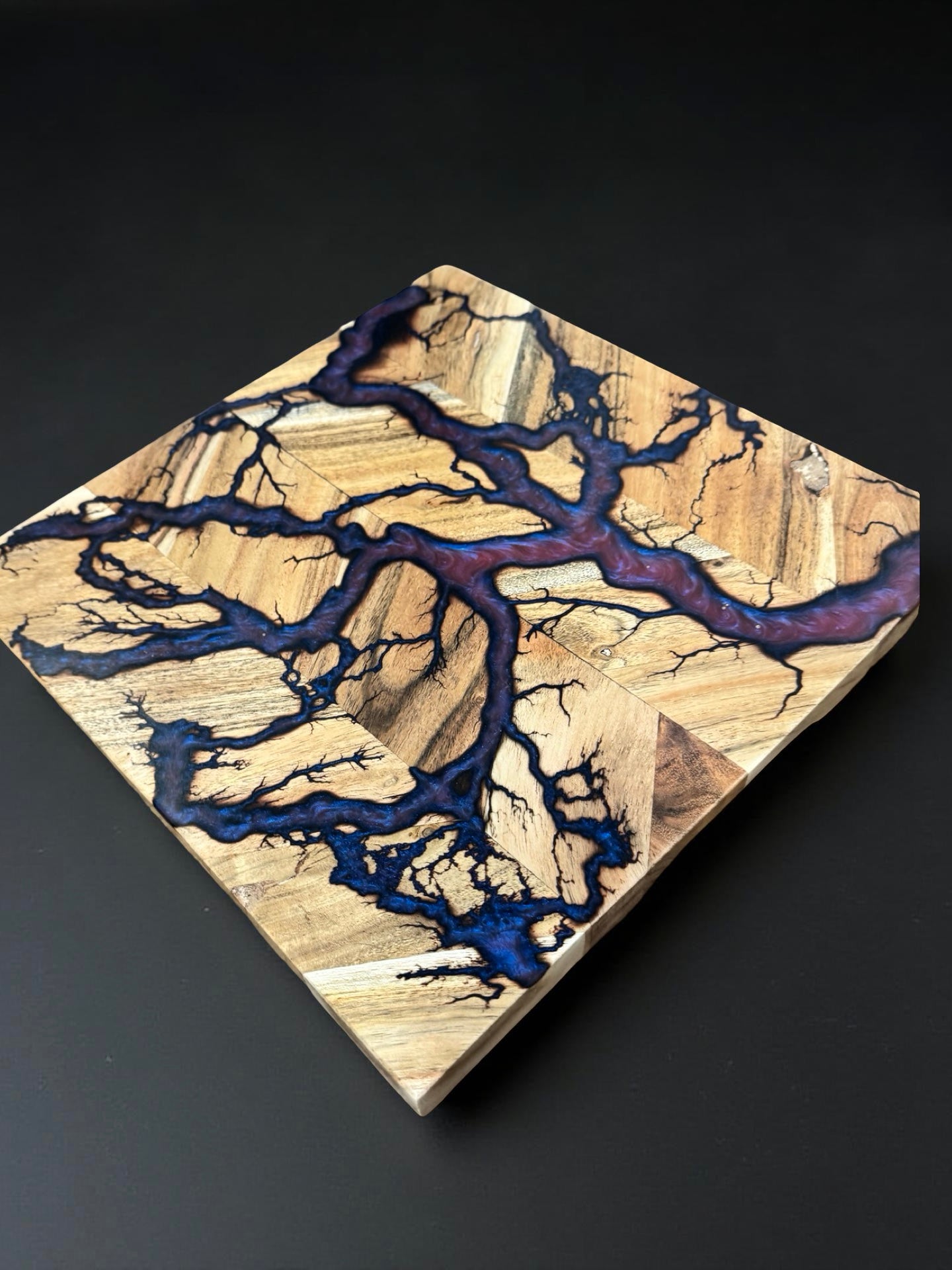 Australian timber chopping board 320 x 320 enhanced with red green chameleon resin movement and energetic fractal burning art produced in Bairnsdale Australia by Fractal Flow Designs Australia’s resin boards