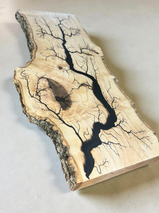 Live edge English oak slab with deep black resin and high voltage fractal burn pattern, artisan timber art