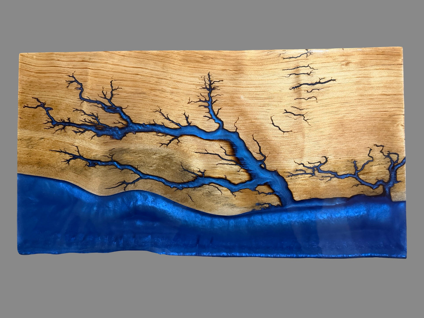     One-of-a-kind Australian resin board with brilliant metallic blue resin flowing beneath detailed fractal burn patterns across beautiful natural timber, 580 x 300 x 30mm, handcrafted for entertaining, housewarming gifts, weddings, anniversaries and everyday serving with style