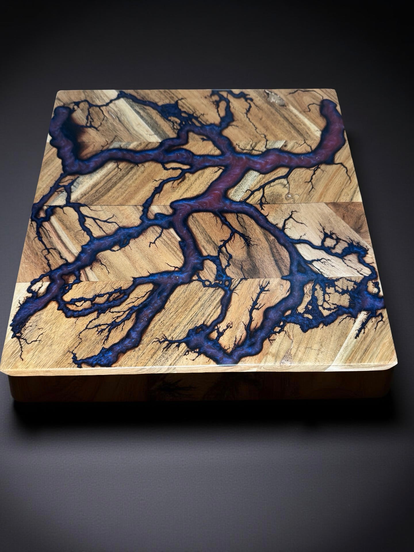 Bold red green chameleon resin chopping board 320 x 320 made in Bairnsdale Australia with electrical style fractal burning artwork and natural Australian timber textures built by Fractal Flow Designs Australia’s resin board brand