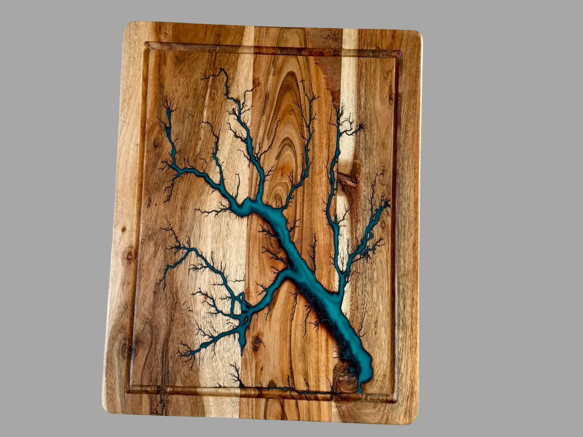     Handcrafted acacia chopping board with flowing marine green resin artwork and lightning inspired fractal burning, luxury Australian kitchen and serving board