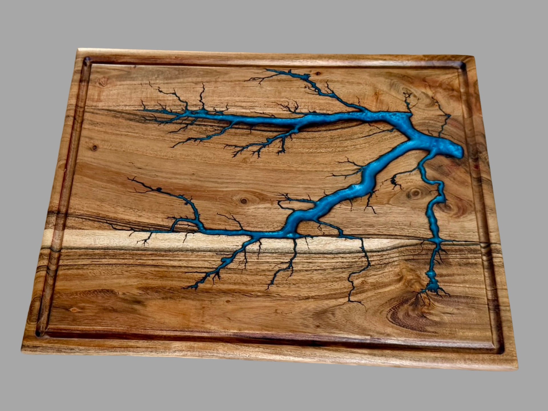     Handmade large acacia cutting board featuring flowing sky blue resin artwork and unique fractal burn detailing, Australian timber kitchen and serving board gift