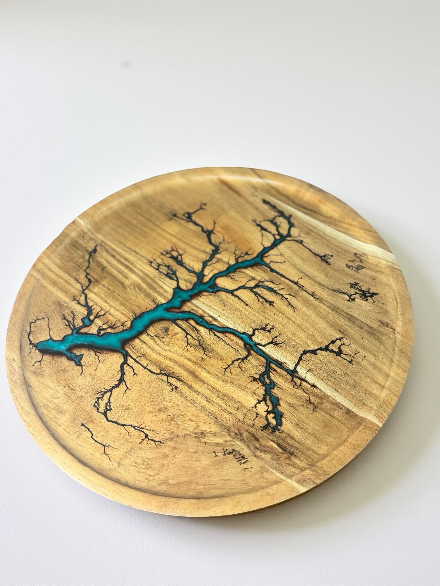 Teal round resin board in motion Australia resin art East Gippsland premium vibe