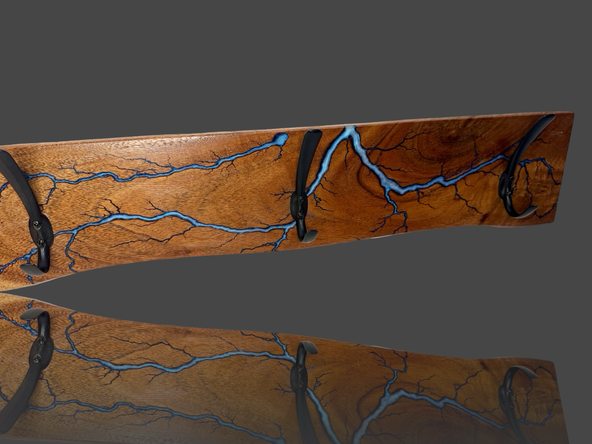 Rustic timber coat rack with bold electric burn lines