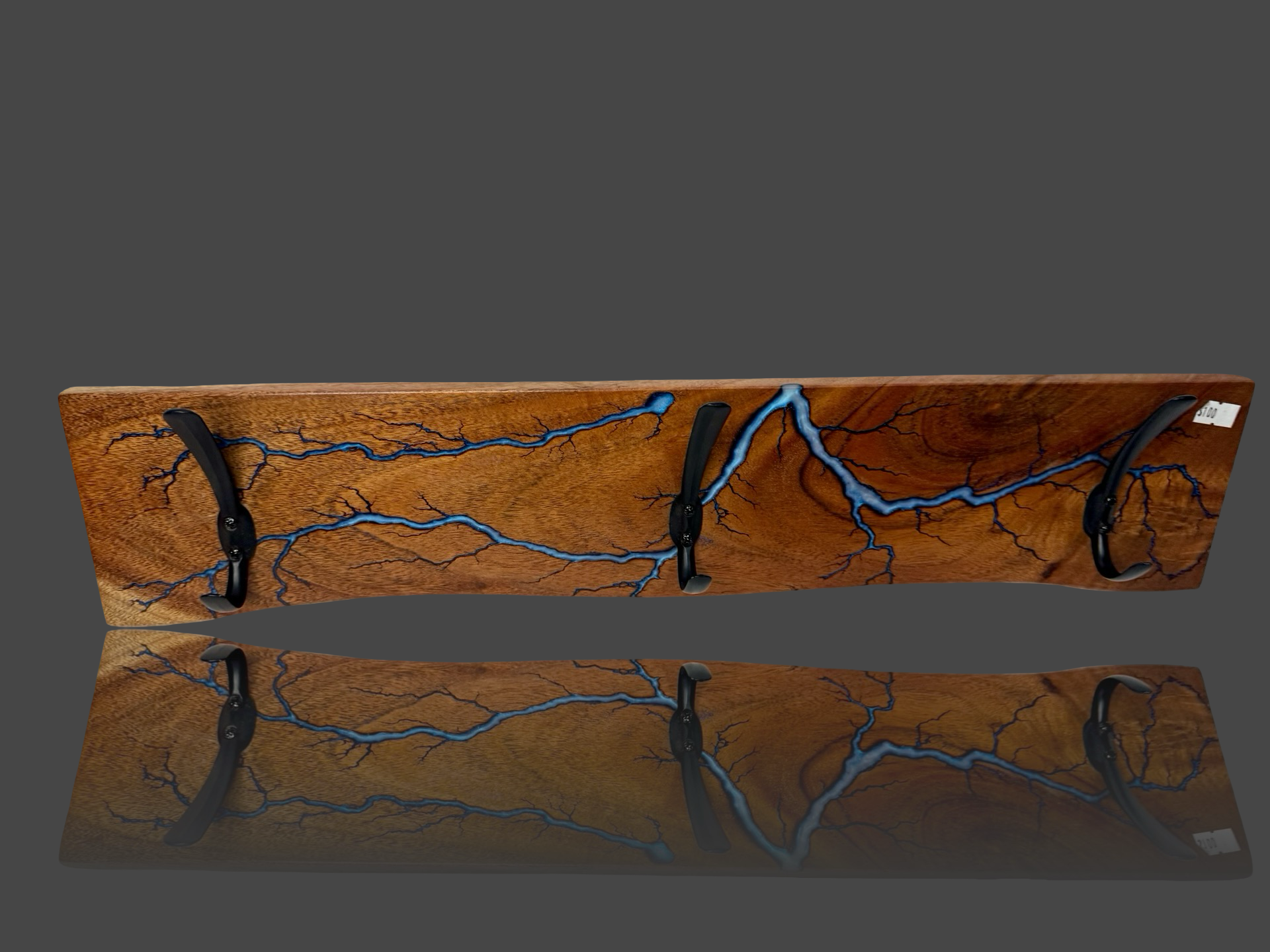 One-of-a-kind wall rack with high-voltage fractal burn design