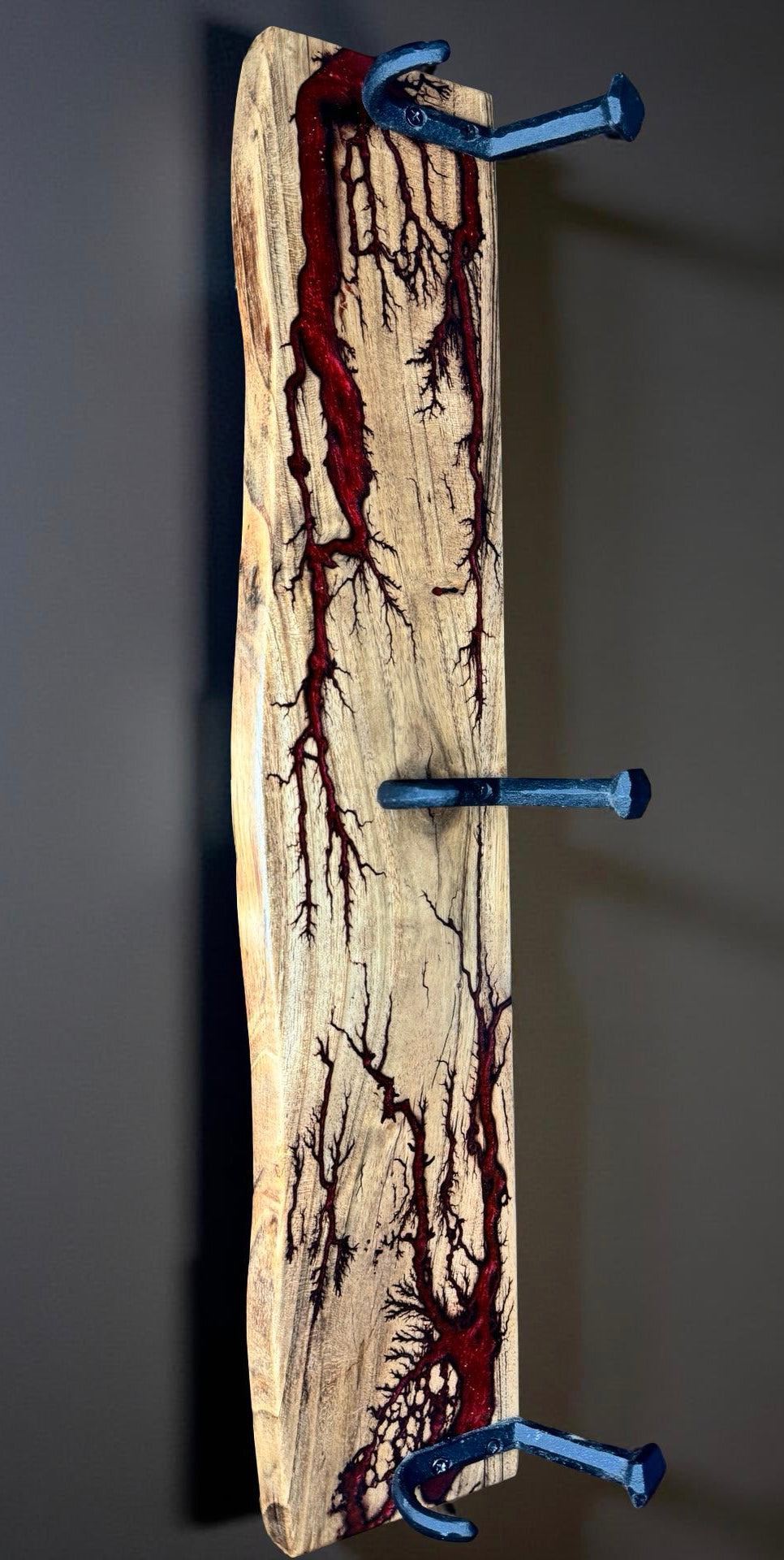 Red resin coat rack with sleek metal hooks, premium Australian home styling